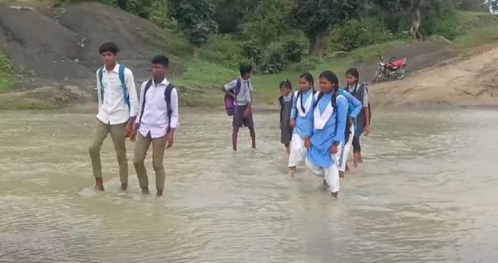 Children Crossing River To School