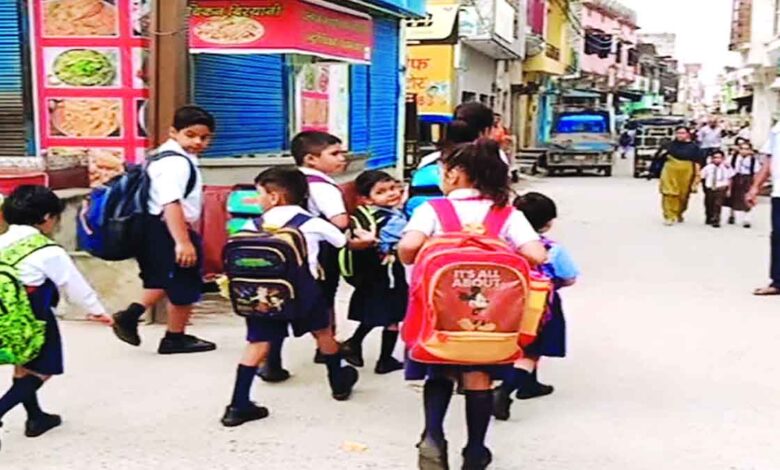 The smile of children is getting lost as their childhood is being crushed under the burden of school bags
